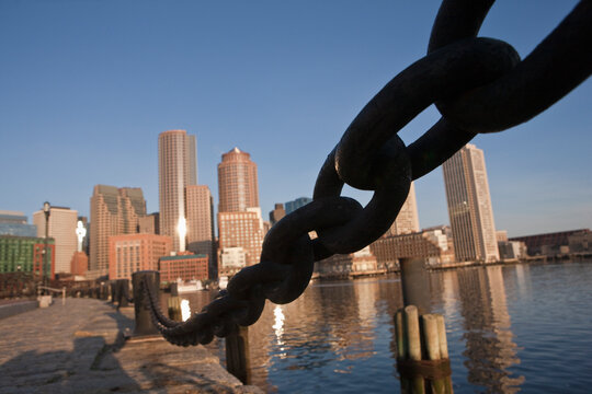 Anchor chain with city skyline in background, Rowes Wharf