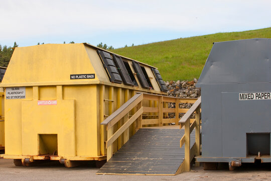 Two recycling containers with access ramp