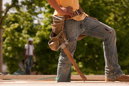 Carpenter standing at a construction site
