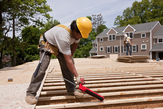 Carpenter using a caulk gun
