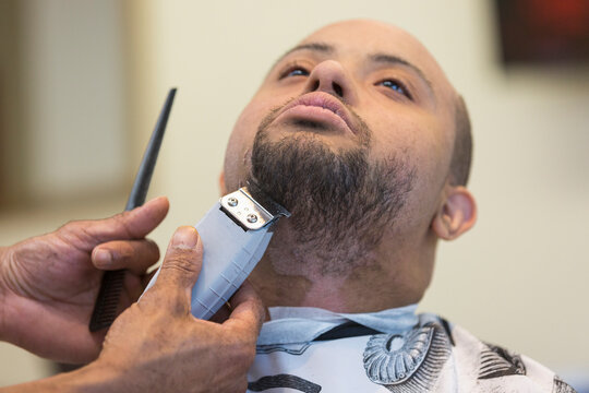 Man with Down Syndrome getting a hair cut
