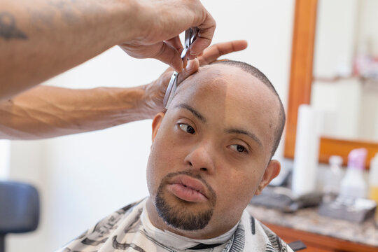 Man with Down Syndrome getting a hair cut
