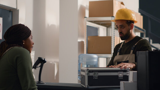 Warehouse employee asking manager for help, unsure what to do with fragile special parcel delivery request, wanting to use hard case protective suitcase to avoid issues during shipment.