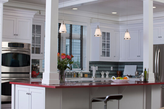 Kitchen in a Green Technology Home with energy efficiency appliances, stone countertops, and