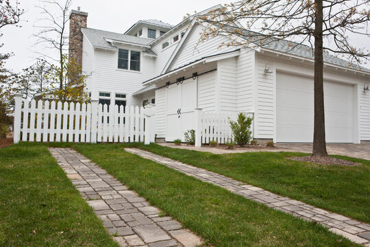 Reflective materials on driveway and drought resistant landscaping at a Green Technology Home