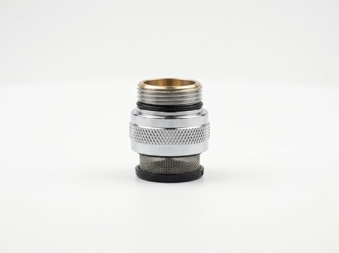 Close-up of a metallic connector with mesh filter against a clean white background
