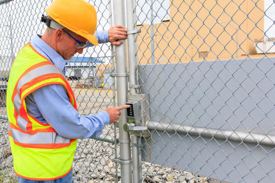 Electrical engineer using security system to enter electrical power plant