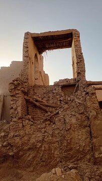 Ruined clay building frame in Erfoud Sahara desert Morocco