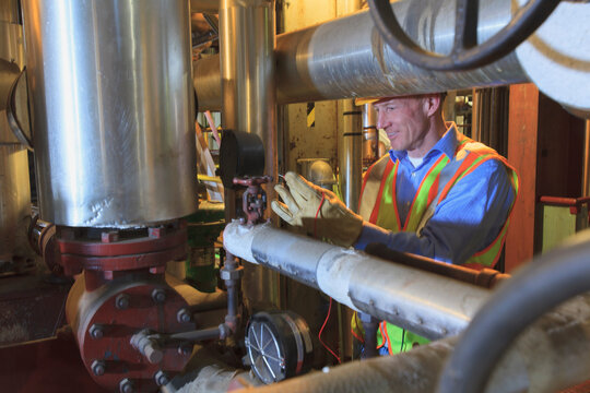 Engineer in electric power plant testing a transducer electrical signal