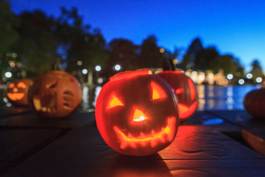Lit up Halloween pumpkins jack-o-lantern at Boston Common Frog Pond