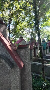 Panning View from Tombstone to Historic Christian Cemetery in Malang, Indonesia.
