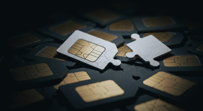 SIM cards and a puzzle piece on a cracked dark surface