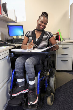 Teen with Cerebral Palsy working in an office