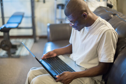 Man with Williams Syndrome working on a computer