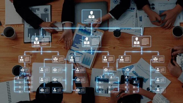 This image showcases a business meeting with professionals collaborating on a table filled with charts and graphs, highlighting digital networking and organizational structure. Raster