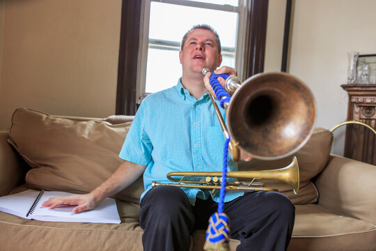 Musician with Visual Impairment playing bugle