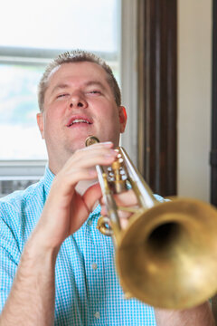 Musician with Visual Impairment playing trumpet