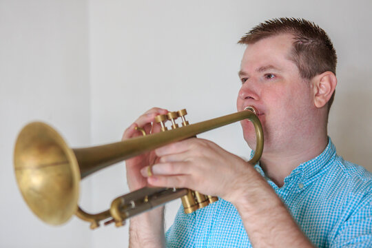 Musician with Visual Impairment playing trumpet
