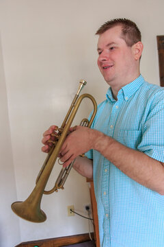 Musician with Visual Impairment playing trumpet