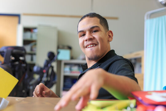 Boy with Spastic Quadriplegic Cerebral Palsy learning at school