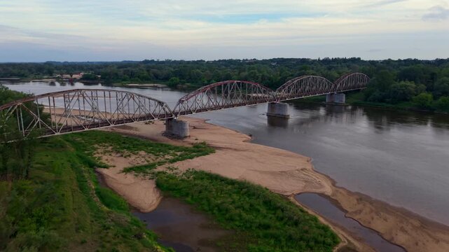 Industrial rusty old steel train bridge, aerial view.