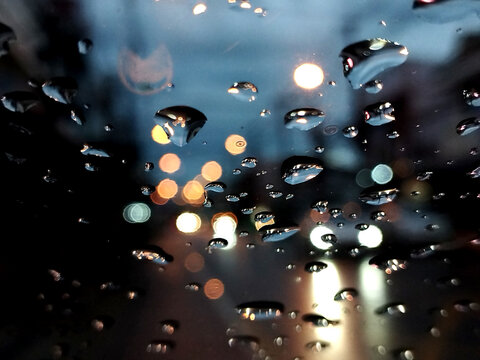 Raindrops on the car window.