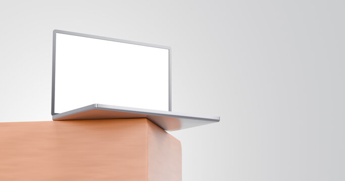 Sleek silver laptop mockup on a wooden desk side angle perspective against a clean white background for minimalistic corporate web design presentations.