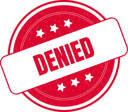 Round red grunge rubber stamp with denied text message and stars on a clean surface