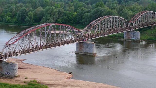 Industrial rusty old steel train bridge, aerial view.
