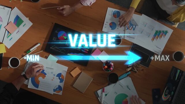 A top-down view of a diverse team engaged in a collaborative meeting, focusing on value optimization strategies through data analysis and visual presentations. Raster