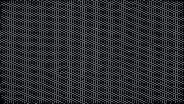 Perforated metal sheet with a regular circular pattern dark gray industrial texture