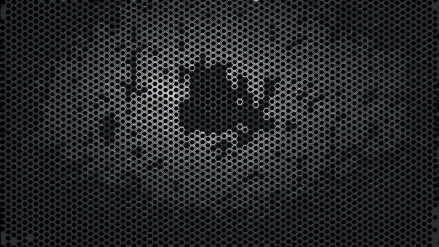 Perforated metal sheet with hexagonal holes and a blurred face visible through it