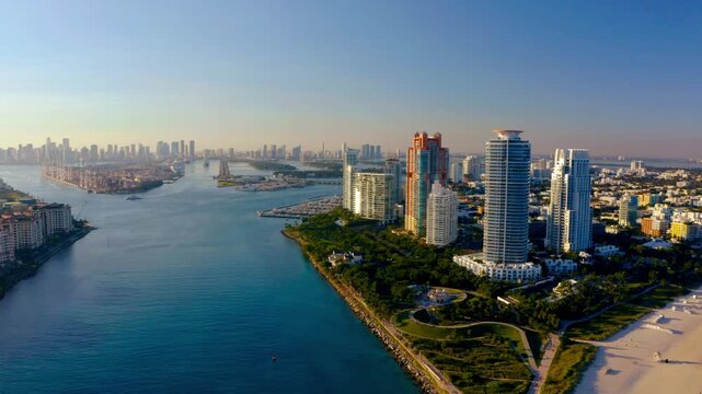 View of Miami skyline over Biscayne Bay with luxury high rises and waterfront parks in urban development