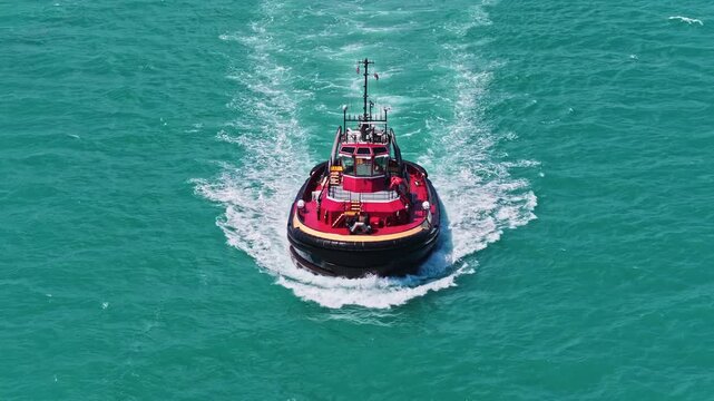 Tugboat sea transportation. Boat tug at sea. Aerial footage of tow boat transportation. Aerial footage. Tugboat sailing at sea top view. Motor boat. Boating and tugging