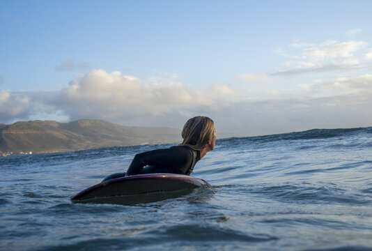 Woman in Imsouane Morocco on surf board