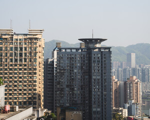 Dense high rise apartment towers in a hazy Chinese megacity © Tim