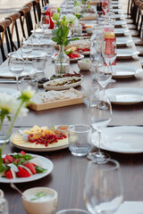Fototapeta premium Waiting for guests. Food on the table. Table setting.