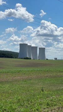 nuclear power plant background blue sky surface close up of cooling towers emitting steam industrial product concept of green energy, atomic station, electricity generation