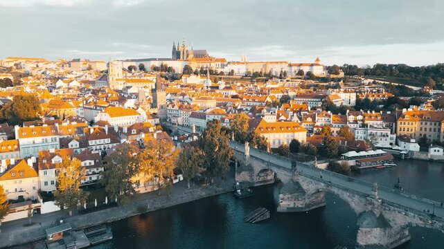 Experience the breathtaking views of Charles Bridge and Prague Castle from above. This aerial journey highlights the beauty of Prague in the morning light over the Vltava River.