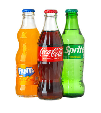 Refreshing coca-cola, fanta, and sprite soda bottles