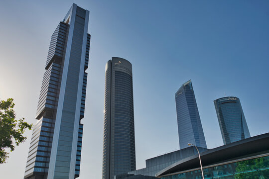 MADRID, SPAIN - JUNE 6, 2026: Low angle view of the skyscrapers of Cuatro Torres Business Area in Madrid, with PwC, KPMG and OHLA logos visible on several towers in the financial district.