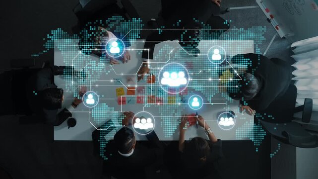 Business team collaboration with digital network concept overlaid on meeting table capturing innovation and technology in professional environment. Entropy.