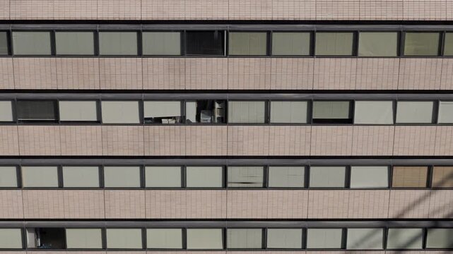 Tokyo Scene  :  Window Blinds Drawn Against the Harsh Afternoon Sun, as if Reflecting the Desolate Reality of the Corporate World  |  Tokyo, Japan
