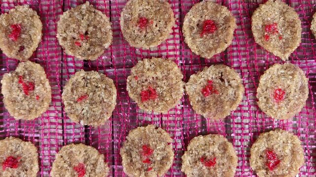 Traditional Balinese Jaje Begina Rice Crackers Drying on Mat