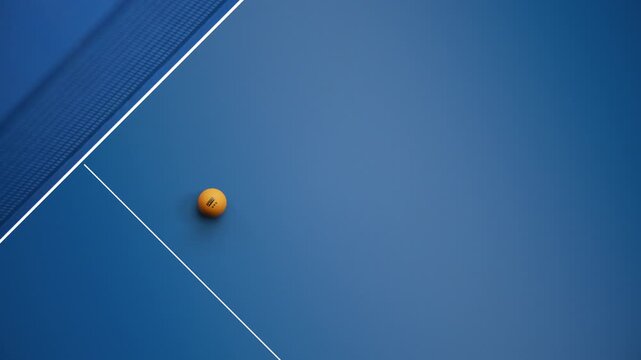 Orange table tennis ball dropping onto a blue ping pong table with net and court lines seen from above, transparent background alpha channel 3D animation with large copy space for sport broadcast over