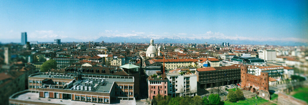 Panoramic view of the city of Turin, Italy, showing the historic city center rooftops with the snowy Alps in the background, Northern Italy, Europe