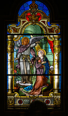 Obraz premium Stained-glass window depicting the Annunciation of the Lord, Franciscan Church of the Annunciation of the Lord, Bratislava, Slovakia.