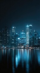 Obraz premium Nighttime cityscape with illuminated skyscrapers reflecting in the water
