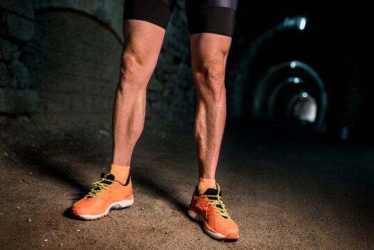 close-up of the worked calf and hamstring muscles of a triathlon runner