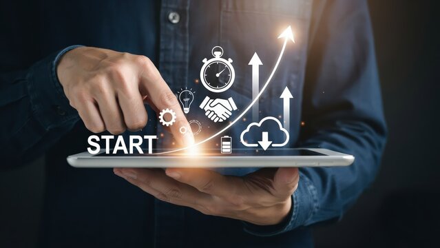 Business person using a digital tablet with growth and startup icons on screen